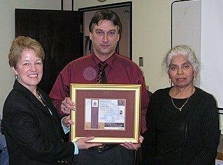 Denis Pigeon receiving Long Service Award